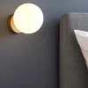 Applique comodino camera da letto ondaluce pallina oro sfera vetro