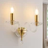 Applique da parete a 2 bracci in vetro trasparente e finiture oro