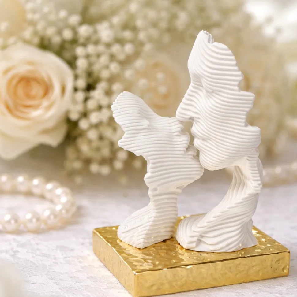 Bomboniera bacio stilizzato oro design moderna bongelli preziosi