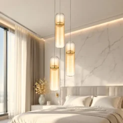 Lampadario oro con capsule pendenti in vetro ambra per camera da letto moderna